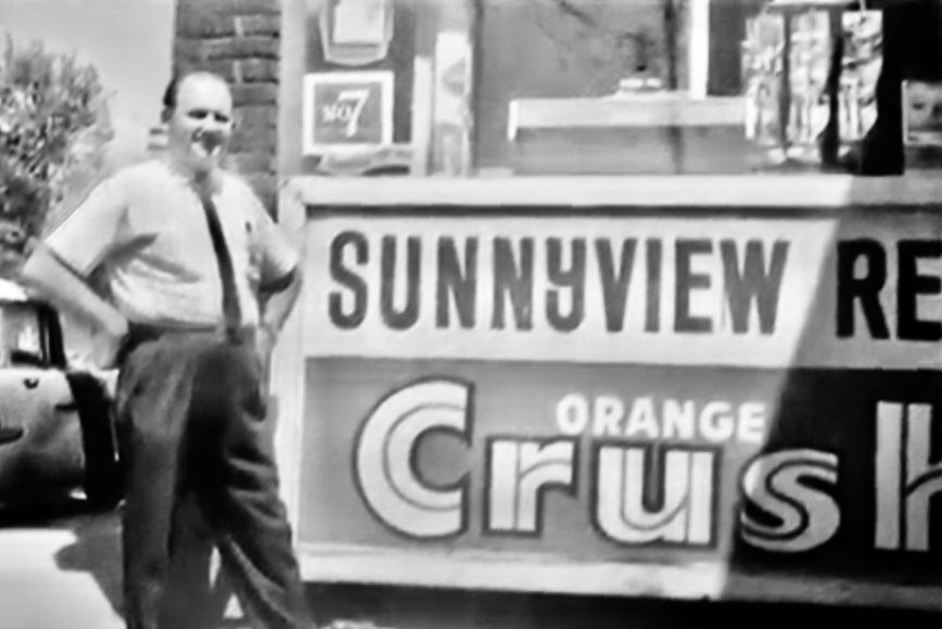 Steve Sromek and his restaurant sign at 41 Roncesvalles Ave. (Photo courtesy of the family.)