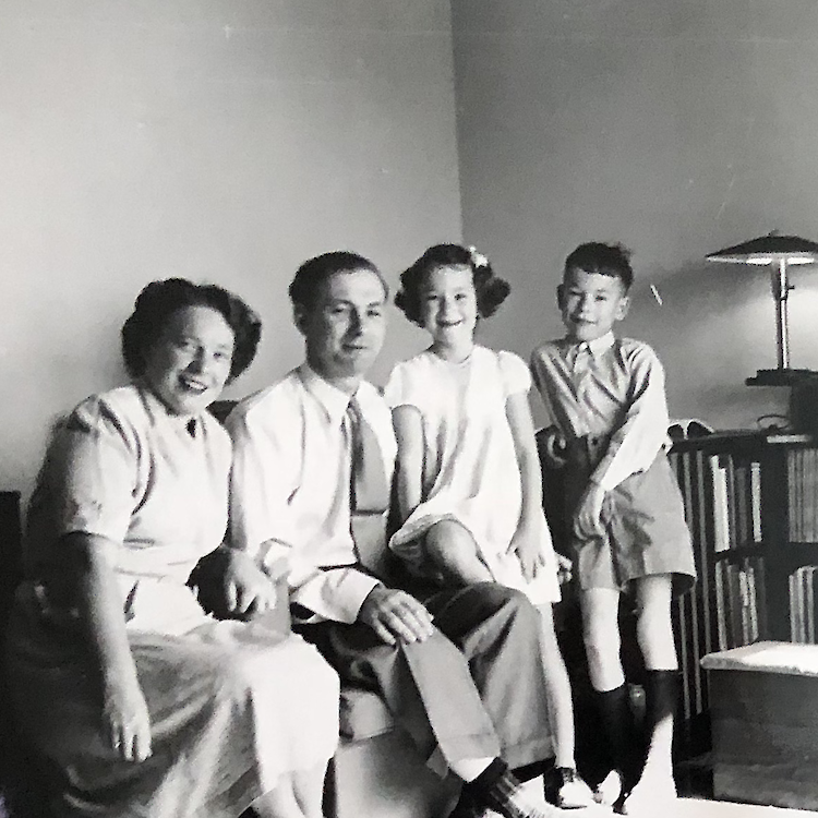 Ingrid's family and the wrap-around desk built by her father from orange-crate wood.