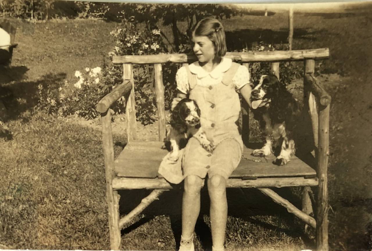 A photo of Doris with the firehall dogs. (Photo courtesy of the family.)