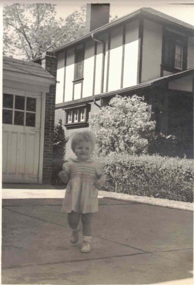Bruce McDougall's sister in front of a home on Indian Rd. (Photo courtesy of the family.